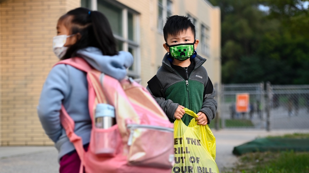 Kindergarten children line up before entering class at Portage Trail Community School which is part of the Toronto District School Board (TDSB), on Tuesday, September 15, 2020. THE CANADIAN PRESS/Nathan Denette