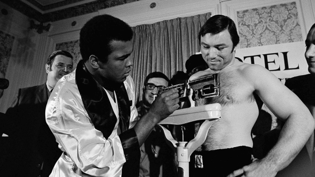 Muhammad Ali checks the weight on Canadian Heavyweight Champion George Chuvalo on May 1, 1972 in Vancouver. They would face each other in 1966 and 1972. (AP Photo)
