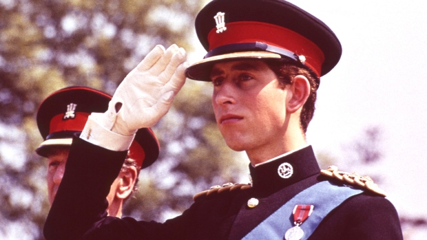 Prince Charles, the Prince of Wales, in the uniform of the Colonel in Chief of the Royal Regiment of Wales, salutes during the Regiment's Colour presentation, at Cardiff Castle in Wales, June 11, 1969. (AP Photo)