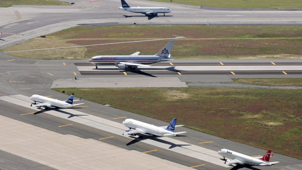 In this Sept. 8, 2008, file photo, planes taxi on runways at John F. Kennedy International Airport in New York. (AP Photo/Mark Lennihan, File)