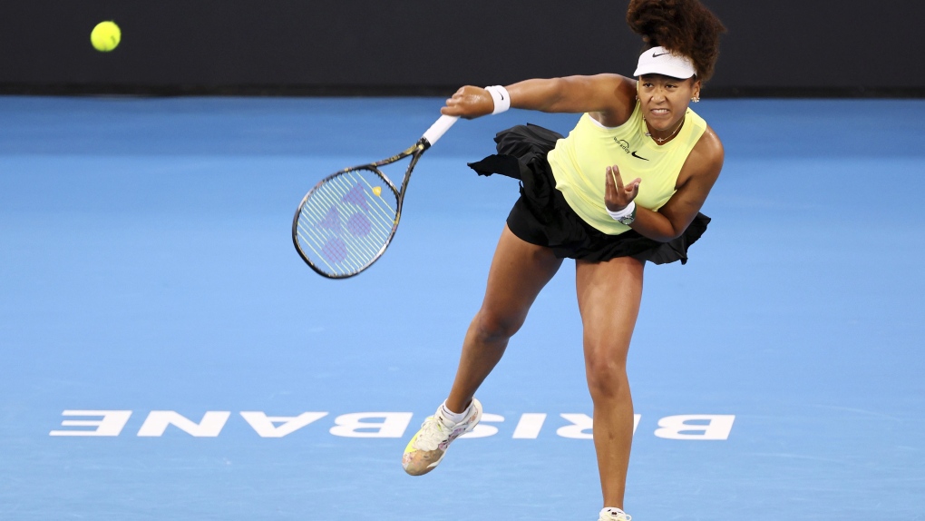 Naomi Osaka of Japan serves in her match against Tamara Korpatsch of Germany during the Brisbane International tennis tournament in Brisbane, Australia, Monday, Jan. 1, 2024. (AP Photo/Tertius Pickard)
