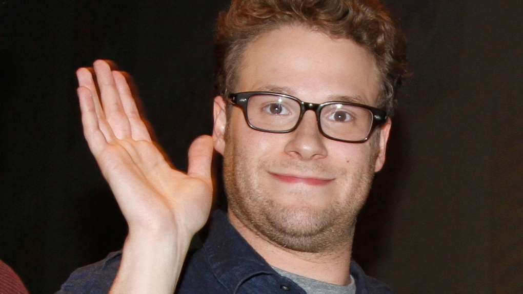 Actor Seth Rogen waves as he leaves a panel for the movie "The Green Hornet" at Comic-Con International Friday July 23, 2010 in San Diego. (AP Photo/Denis Poroy)